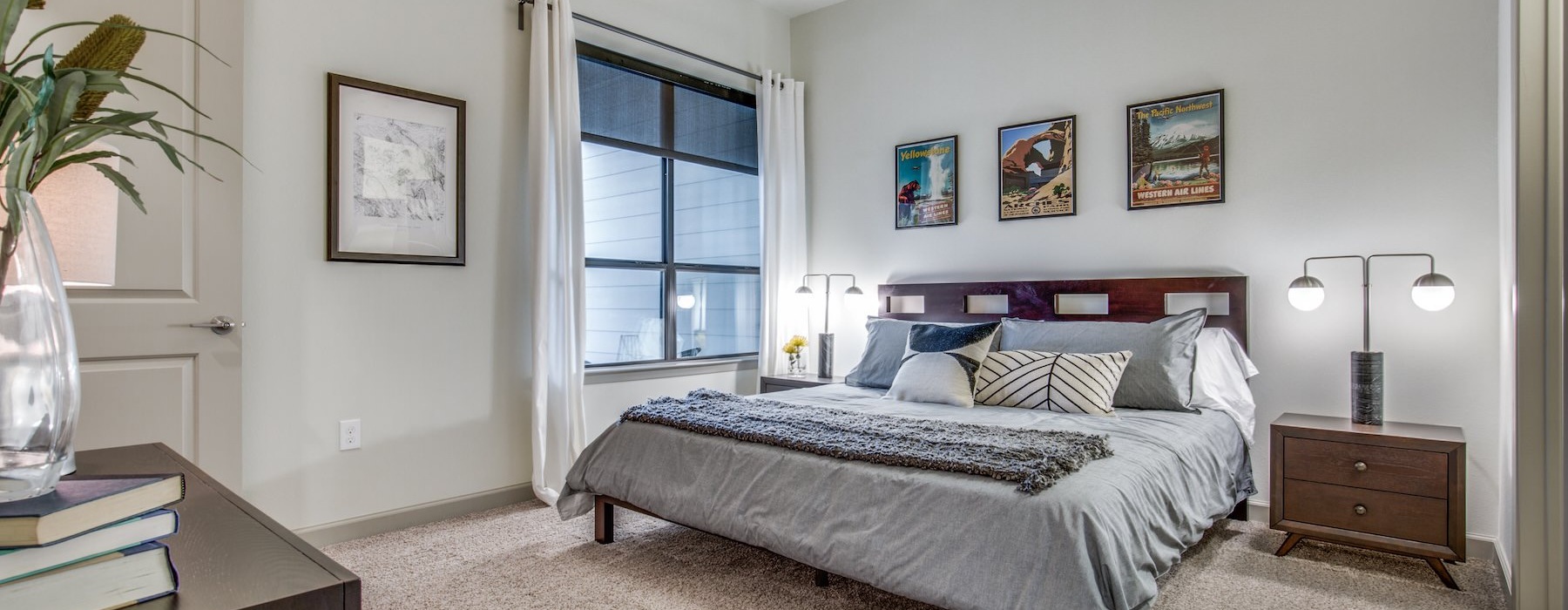 a bedroom with a bed and a fan