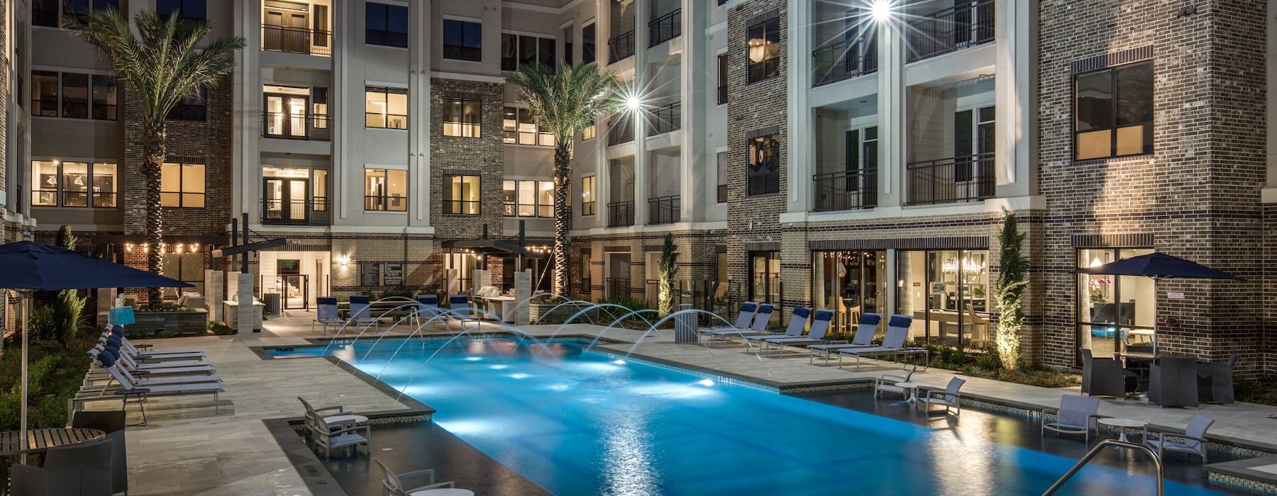a swimming pool in front of a building