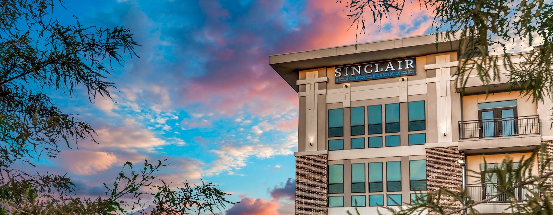 Find your perfect fit at Sinclair a building with a sign on it